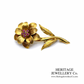 Fine Ruby-set Flower Brooch (18ct gold)